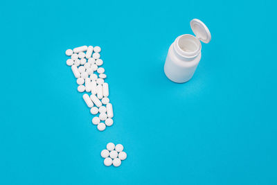 High angle view of blue paint on white background