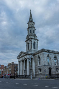 View of building against cloudy sky