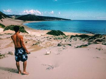 Man at sea against sky