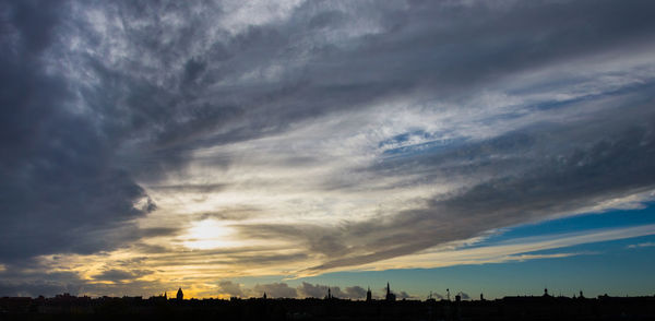 Silhouette landscape against sky during sunset