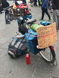 Low section of woman with bicycle on street