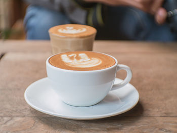 Close-up of coffee cup on table
