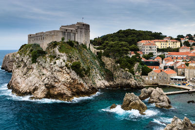 View of sea with buildings in background