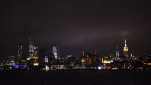 Illuminated buildings in city at night