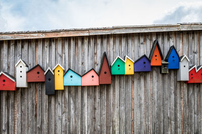 Colorfull bird boxes on wall