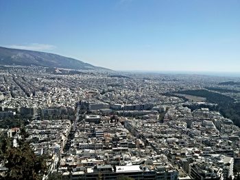 Aerial view of cityscape against sky