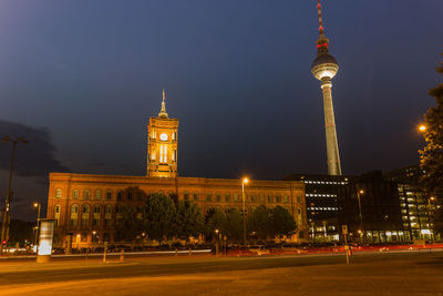 Illuminated building against sky at night