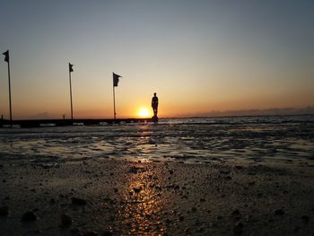 Scenic view of sea against clear sky during sunset