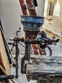 Old rusty bicycle against wall