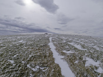 Scenic view of sea against sky during winter