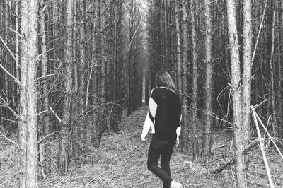 Woman standing in forest