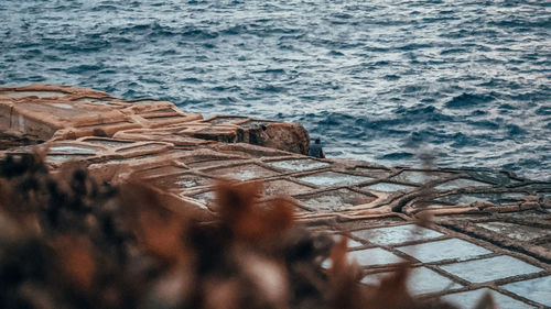 High angle view of rusty metal on beach