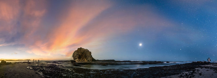 Scenic view of sea against sky at sunset