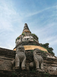 Low angle view of statue against sky, a beautiful sight from historic city, ayutthaya.