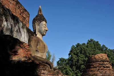 Low angle view of statue against sky