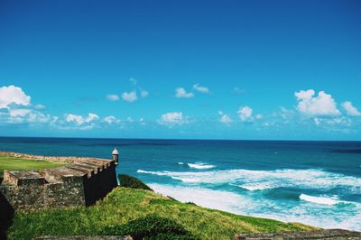 Scenic view of sea against blue sky