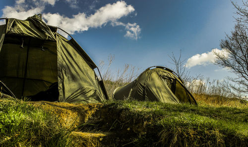 Low angle view of tent on field against sky