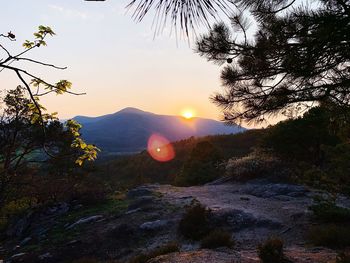 Scenic view of mountains against sky at sunset