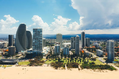 Modern buildings in city against sky