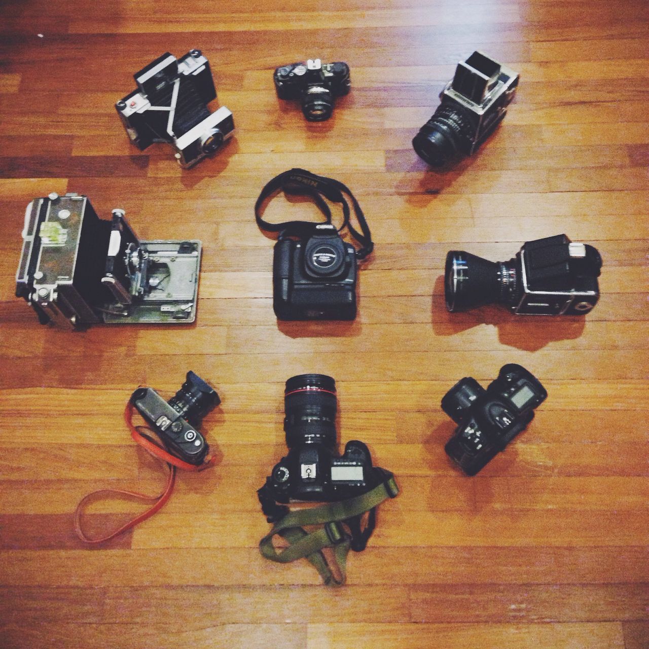 indoors, table, still life, high angle view, wood - material, technology, close-up, music, arts culture and entertainment, no people, pen, wireless technology, hardwood floor, variation, connection, wooden, directly above, arrangement, musical instrument, pencil