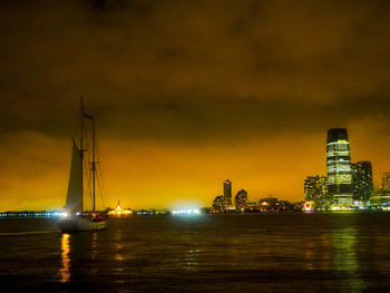 Boats in river at night