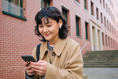 Young woman using mobile phone