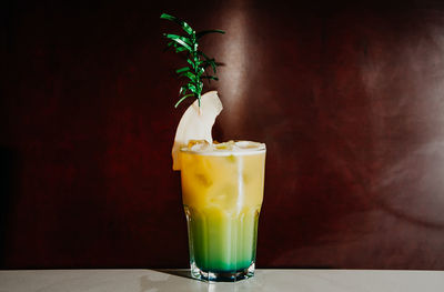 Freshly made tropicana cocktail against dark background