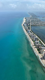 High angle view of swimming pool by sea against sky