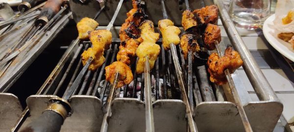 High angle view of meat on barbecue grill