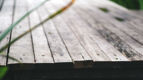 High angle view of wooden bench on table