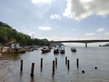 Boats moored in river 