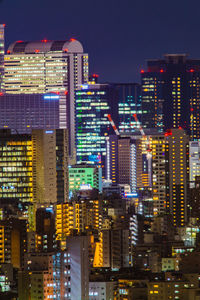 Illuminated buildings in city at night