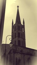 Low angle view of bell tower against sky