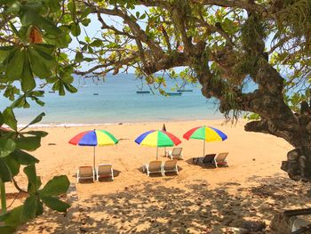 View of lounge chairs on shore