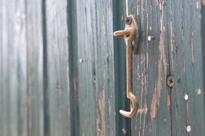 Full frame shot of rusty metal latch on door