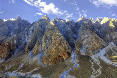 Panoramic view of snowcapped mountains against sky