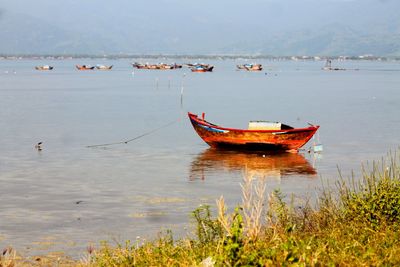 Boats in calm lake