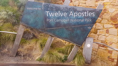 Information sign on old stone wall