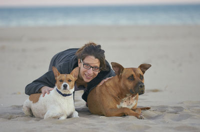 Dogs on beach by sea