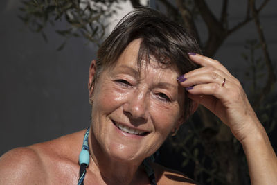 Close-up portrait of smiling senior woman