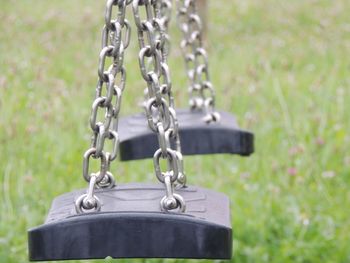 Close-up of metal chain on field