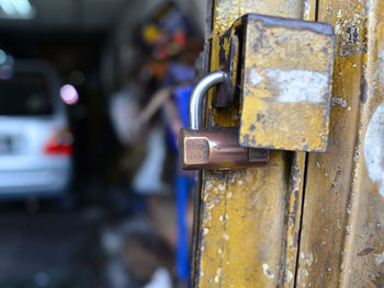 Close-up of padlocks on metal