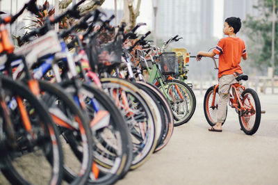 Man cycling on bicycle in city