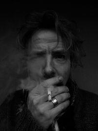 Portrait of man smoking cigarette