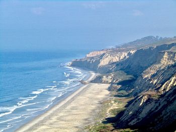 Scenic view of beach against clear sky