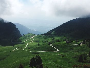 Scenic view of landscape and mountains against sky