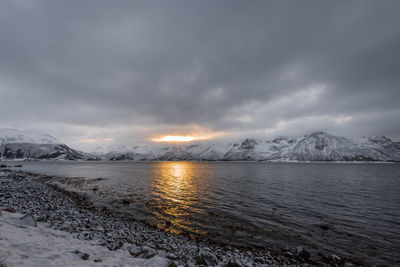 Scenic view of snowcapped mountains against sky during winter