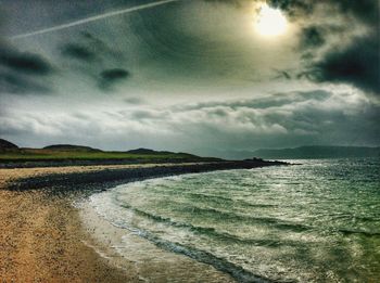 Scenic view of sea against cloudy sky