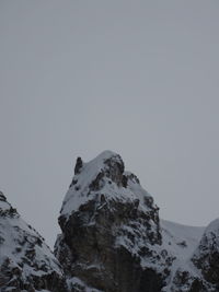 Scenic view of snowcapped mountains against clear sky