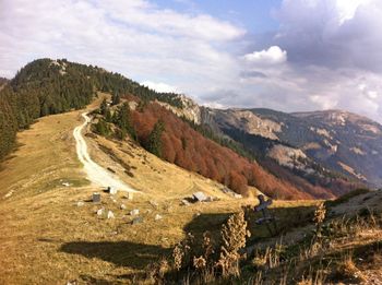 Scenic view of landscape and mountains against sky